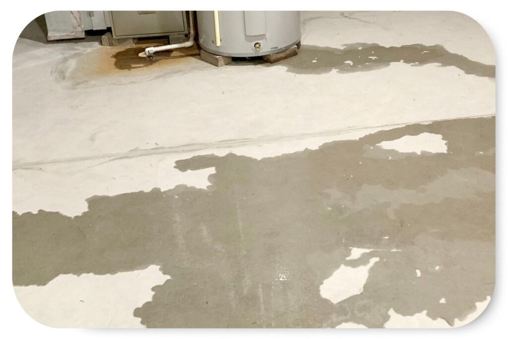 water leak on concrete floor in a residential basement