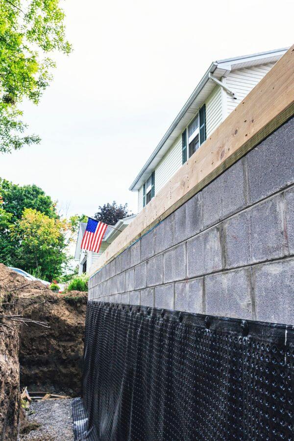 New construction addition to a residential home with exterior basement waterproofing