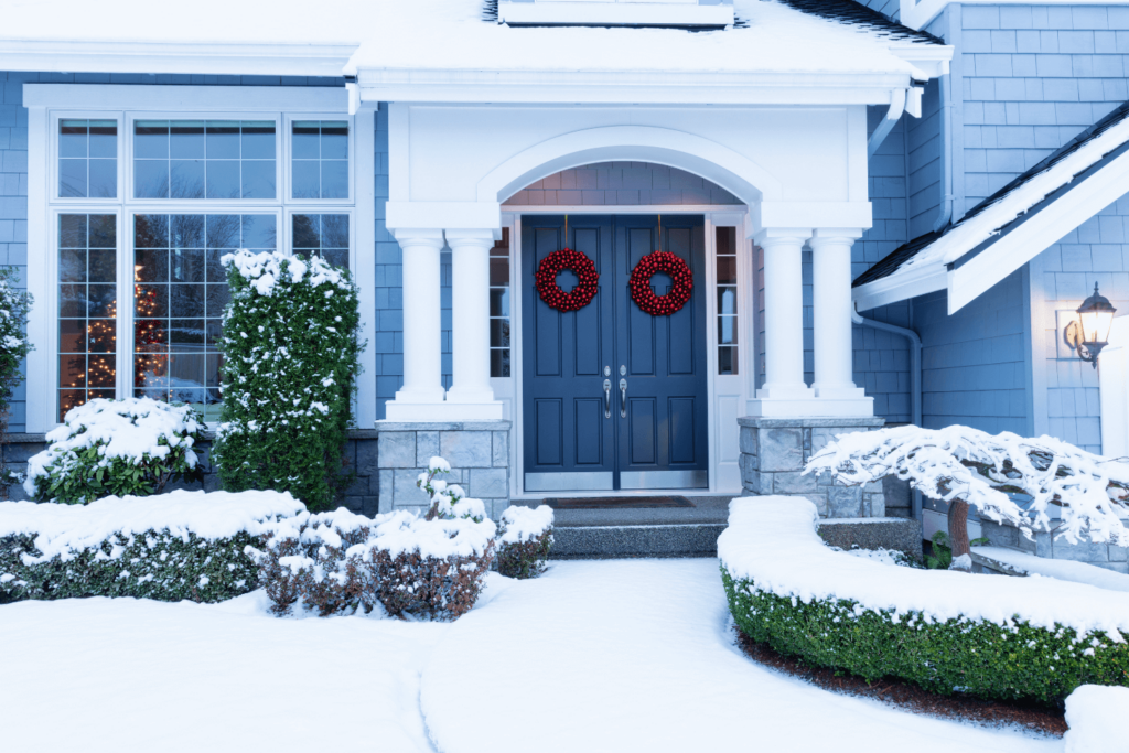 Home with basement surrounded by snow.