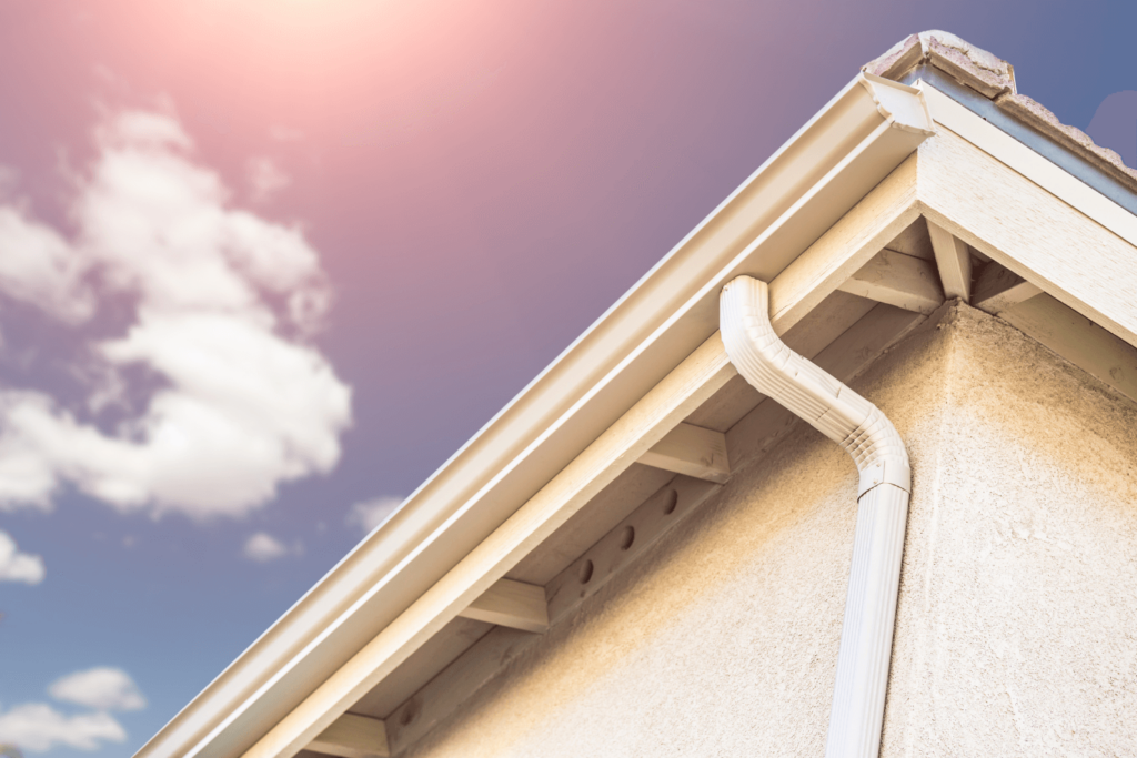 A home with a white gutter system