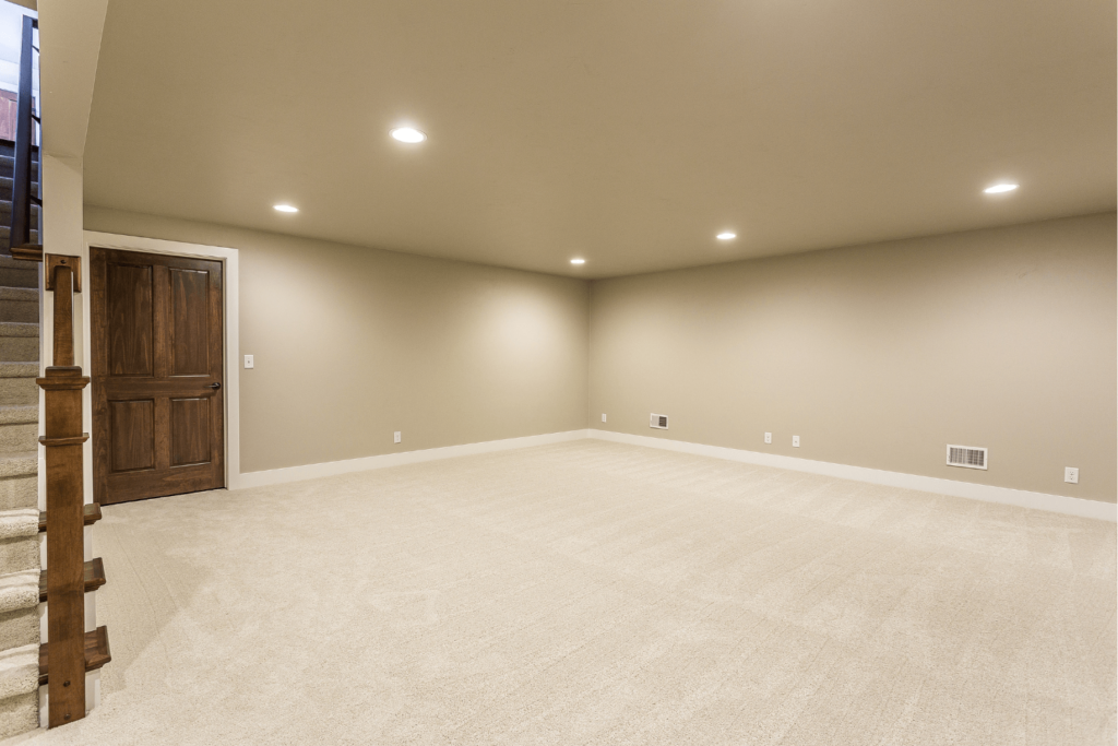 Stair case leading down to an empty basement