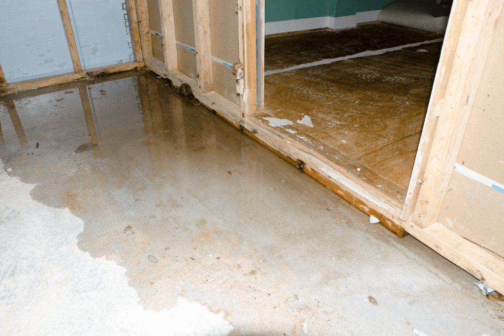 water leaking on the ground in an unfinished basement