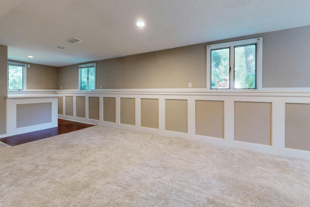 finished basement with natural lighting from many windows