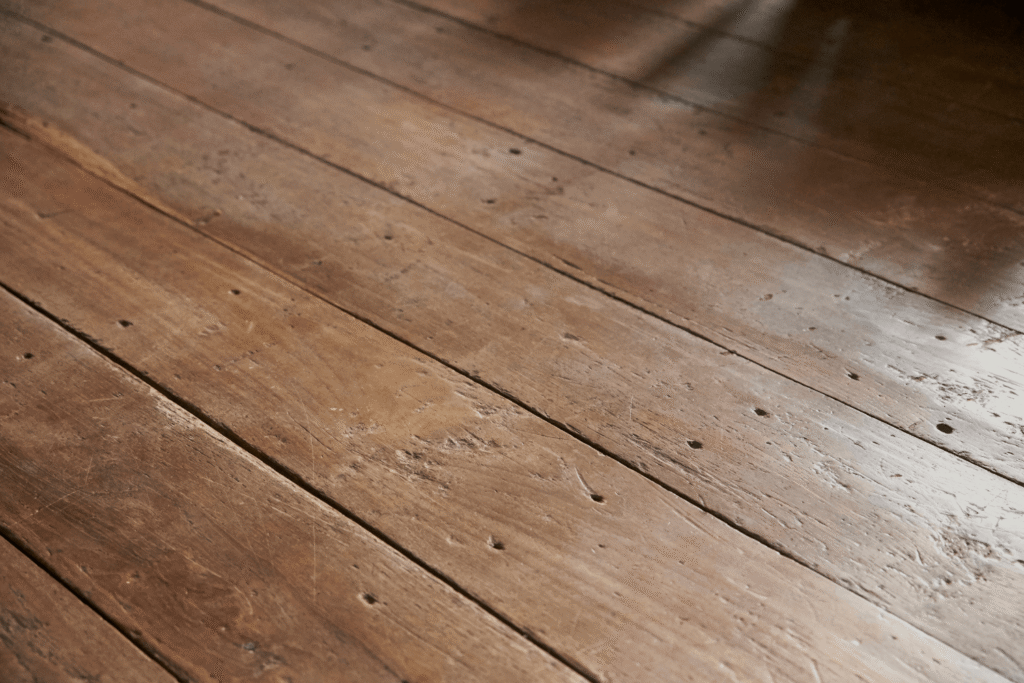old, uneven wood floor planks in a home